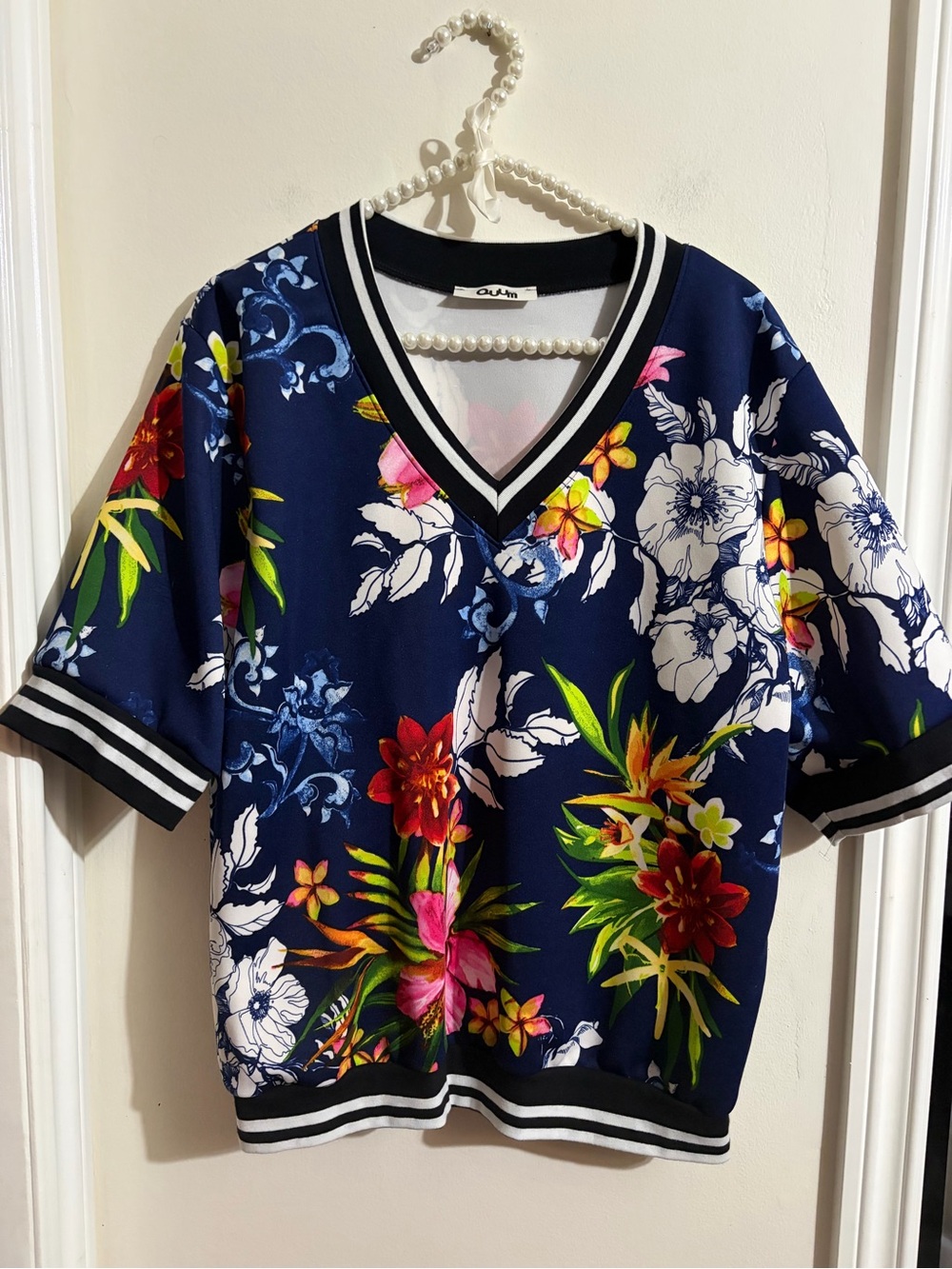 Ouum Navy Floral V-Neck Top with Black-White Stripe Trim